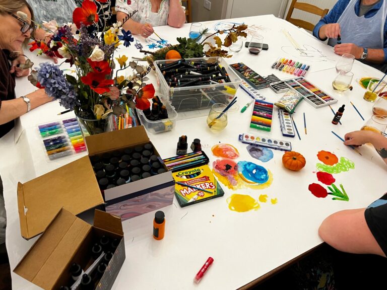Adult creative session table with art materials
