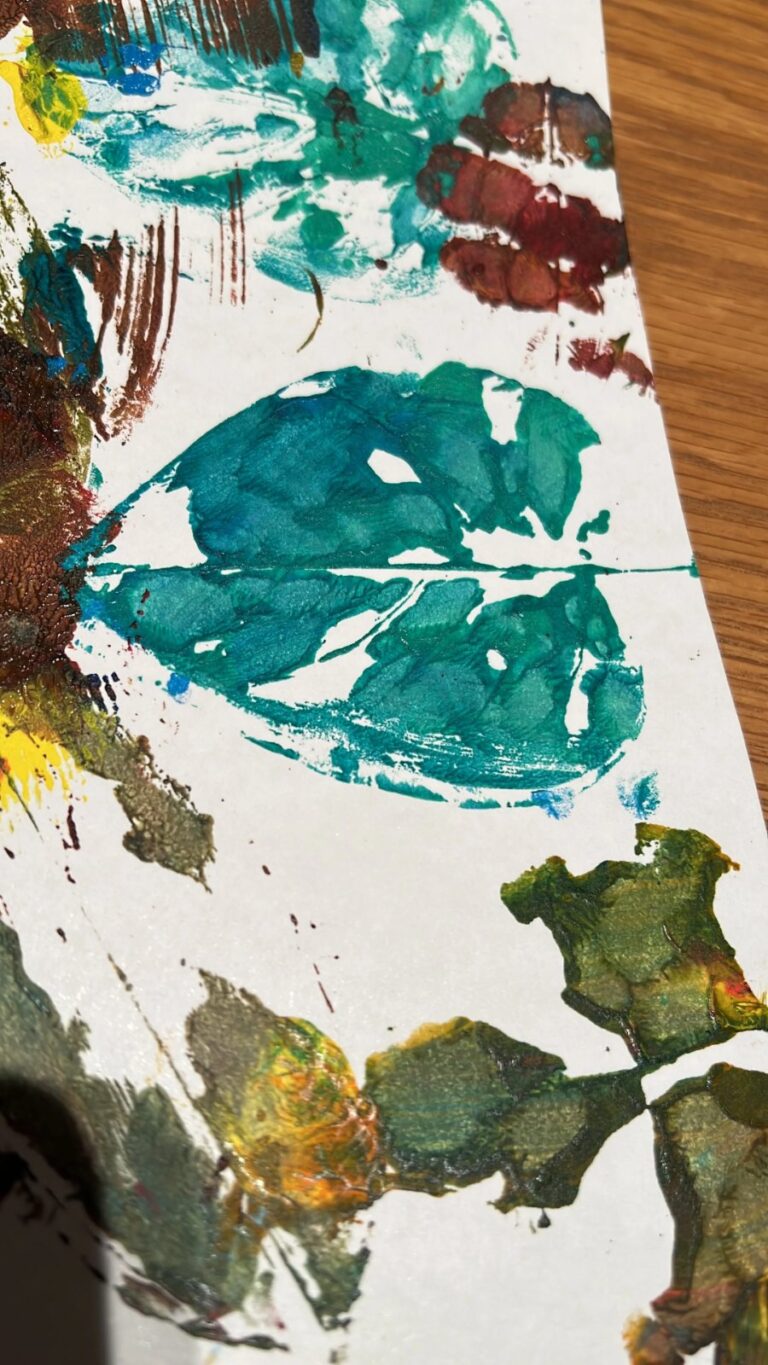 Leaf printing with paint at a children's creative session