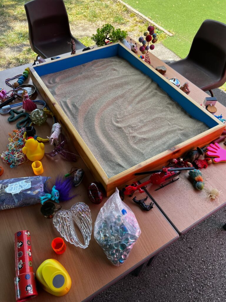 Sand tray with miniature figures